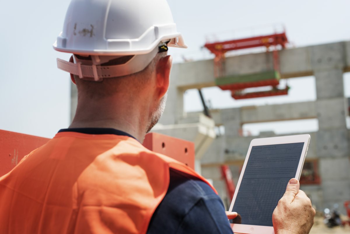 Early Builder Involvement in Commercial Construction: Why It Saves Time and Money 2 construction worker working outdoors with project